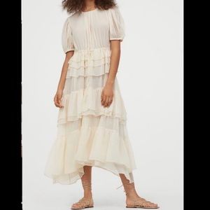 Beautiful off white ruffled dress.